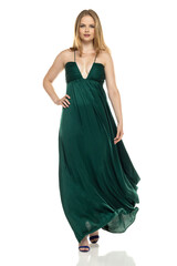 Naklejka premium Full body front view portrait of elegant lovely blond lady walking isolated on white background in green long dress