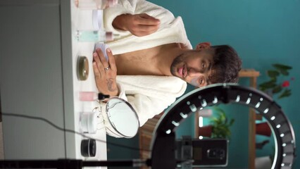 Arab male blogger is broadcasting live and telling on social networks how to take care of your facial skin and be beautiful. The concept of beauty treatments at home