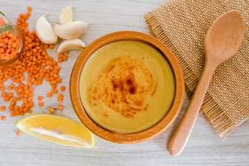 pumpkin soup in a wooden bowl