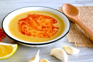 pumpkin soup in a bowl on the table