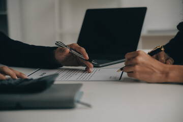 Businessman or job seeker review his resume on his desk before send to finding a new job with pen,...