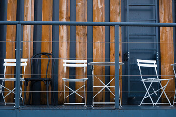 Chairs on a background of wooden planks