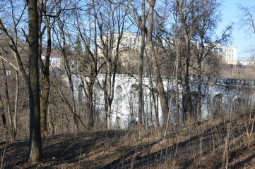 Russia, Kaluga city, stone bridge, trees in the forest