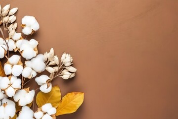 Naklejka na ściany i meble Autumn Floral Flat lay background composition. Dried white fluffy cotton flower branchwith green leaf top view on colored table with copy space. : Generative AI