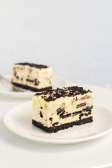 homemade no bake cookies and cream cheesecake bar, Creamy cheesecake bar with chocolate cookies and cream biscuits.