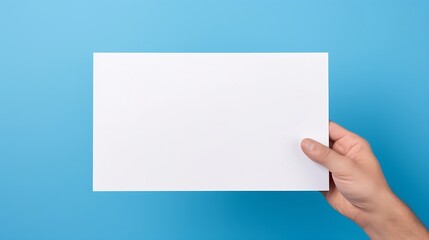 hand holding white blank paper isolated on blue background : Generative AI