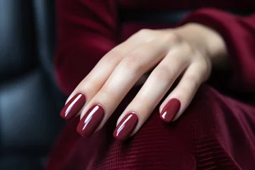 Foto op Plexiglas Woman hand with burgundy color nail polish on her fingernails. Burgundy nail manicure with gel polish at luxury beauty salon. Nail art and design. Female hand model. French manicure. Generative AI. © Artinun