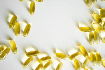 Close up capsules of Omega 3 on white background. Health care concept. Medical pill or vitamin's capsule pattern. Medicine, healthcare or pharmacy concept.