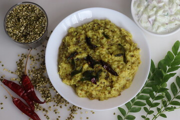 Wholesome Moong Dal Kichadi paired with refreshing cucumber raita, a balanced Indian meal