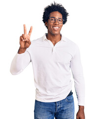 Handsome african american man with afro hair wearing casual clothes and glasses smiling looking to the camera showing fingers doing victory sign. number two.