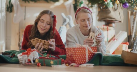 Two Female Friends Talking During Christmas Relaxing Preparing For Xmas Time