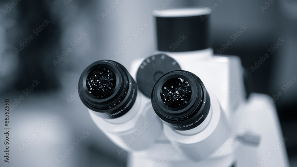 Fototapete eyepiece of a laboratory microscope in blue. two black microscope eyepieces for examining biological