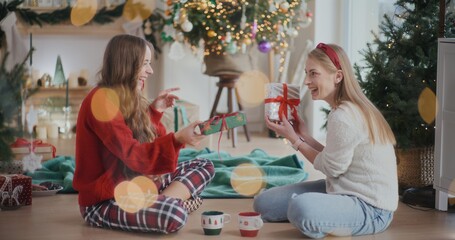 Two Female Friends Talking During Christmas Relaxing Preparing For Xmas Time