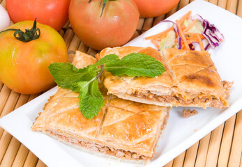 Puff pastry empanada stuffed with tuna