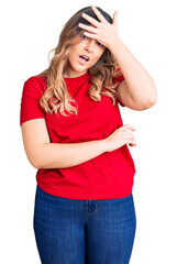 Young caucasian woman wearing casual clothes surprised with hand on head for mistake, remember error. forgot, bad memory concept.