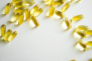 Food supplements, omega-3 fish oil pills on white background copy space.