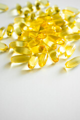 Close up cod liver oil omega 3 gel capsules. Fish oil capsules with omega 3 on white background.