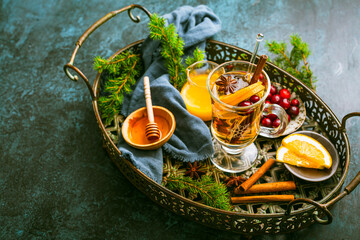 Delicious white mulled wine with orange, honey, cranberries and spices