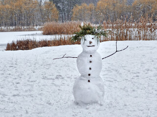 Snowman in snowy forest