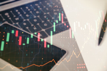 Multi exposure of abstract financial graph with world map on modern computer background, financial and trading concept