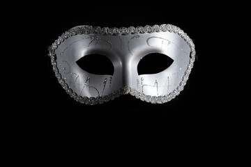 Carnival mask, a Venetian-style masquerade piece, theatrical performance, black background