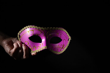 Carnival mask in hand, opera, acting courses, theater education