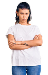 Young woman wearing casual clothes skeptic and nervous, disapproving expression on face with...