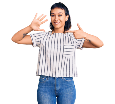 Young woman wearing casual clothes showing and pointing up with fingers number seven while smiling confident and happy.