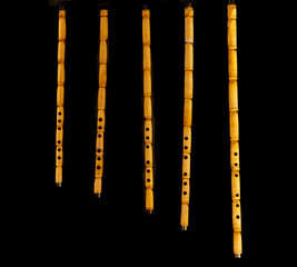 Bamboo flute. Wind instrument of various sizes. isolated on black background