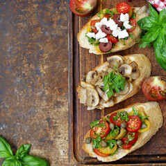 assorted bruschetta with tomatoes, mushrooms and cheese