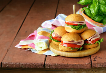 stack of mini burgers for a picnic