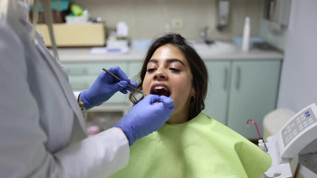 Young woman making sure her teeth are healthy