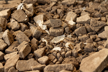 Rubber bags are mixed or contaminated in soil for plastic and environment pollution concept.