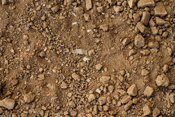 microplastic mixed or contaminated in soil, top view.