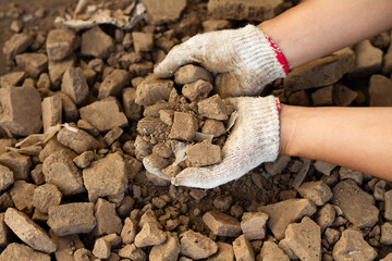 hand holding soil mixed or contaminated with plastic and microplastic. Environment and plastic...