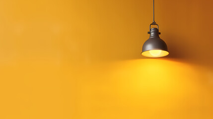 Obraz premium A lamp hangs on a yellow wall and illuminates it, space for text or presentation