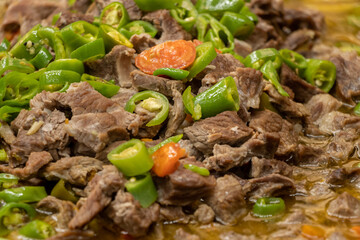 Roast meat ( kavurma ) with green pepper at the restaurant
