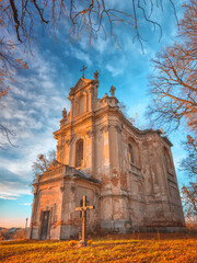 view to abandoned cathedral in autumn day in red color edit