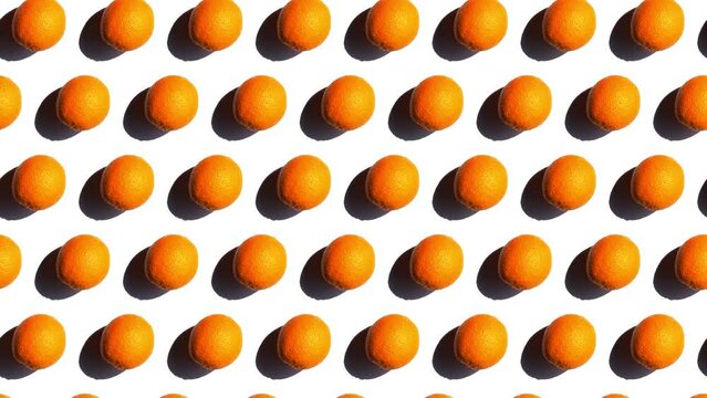 Rolling and moving diagonally oranges in fine patter, isolated fruits with shadow on white. This high-quality footage showcases natural essence of Vitamin C, making it ideal for promoting juices