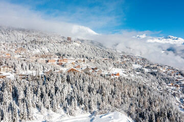 The ski resort of Crans-Montana in the Swiss Alps, covered by fresh snow. Aerial view