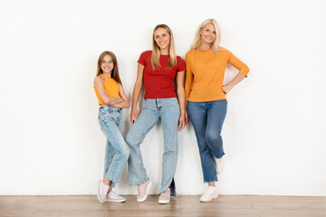 Obraz premium Happy beautiful three generation women family posing together