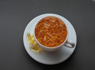 white cup and saucer filled with vitamins