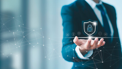 Businessman holds a shield with a lock in his hand on a global network connection. Data protection...