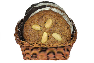 Original Nuremberg Elisen type Lebkuchen (gingerbread) in a basket isolated on white background. Nuremberg is a city in Germany and well-known for its gingerbread skilled crafts and trades.