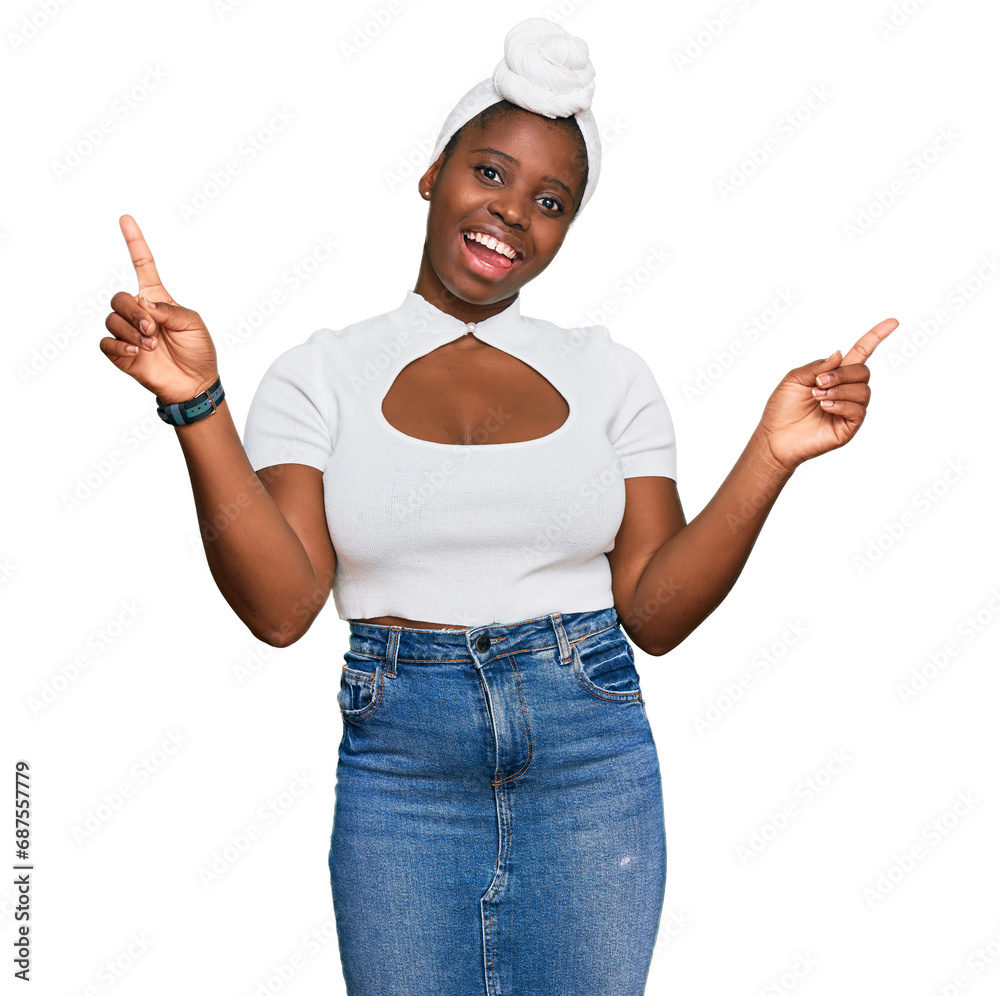 Poster Young african woman with turban wearing hair turban over isolated background smiling confident pointing with fingers to different directions. copy space for advertisement