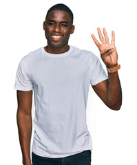 Young african american man wearing casual white t shirt showing and pointing up with fingers number four while smiling confident and happy.