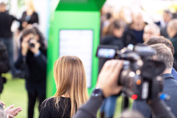 Filming publicity or media event with a video or television camera