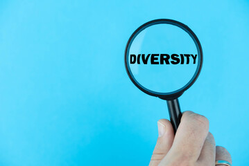 Diversity word, under a magnifying glass focused in on the term. A visual representation of the...