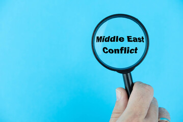 Middle East Conflict, under magnifying glass focused on the term. A visual exploration of the...