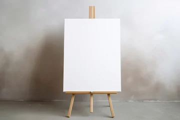 Poster Wooden easel with blank canvas against a beige wall © edelweiss7227